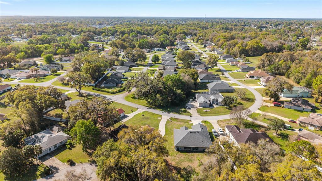 10090 Southwest 78th Court Ocala, FL 34476 - Photo 52 of 52 an aerial view of residential houses with outdoor space