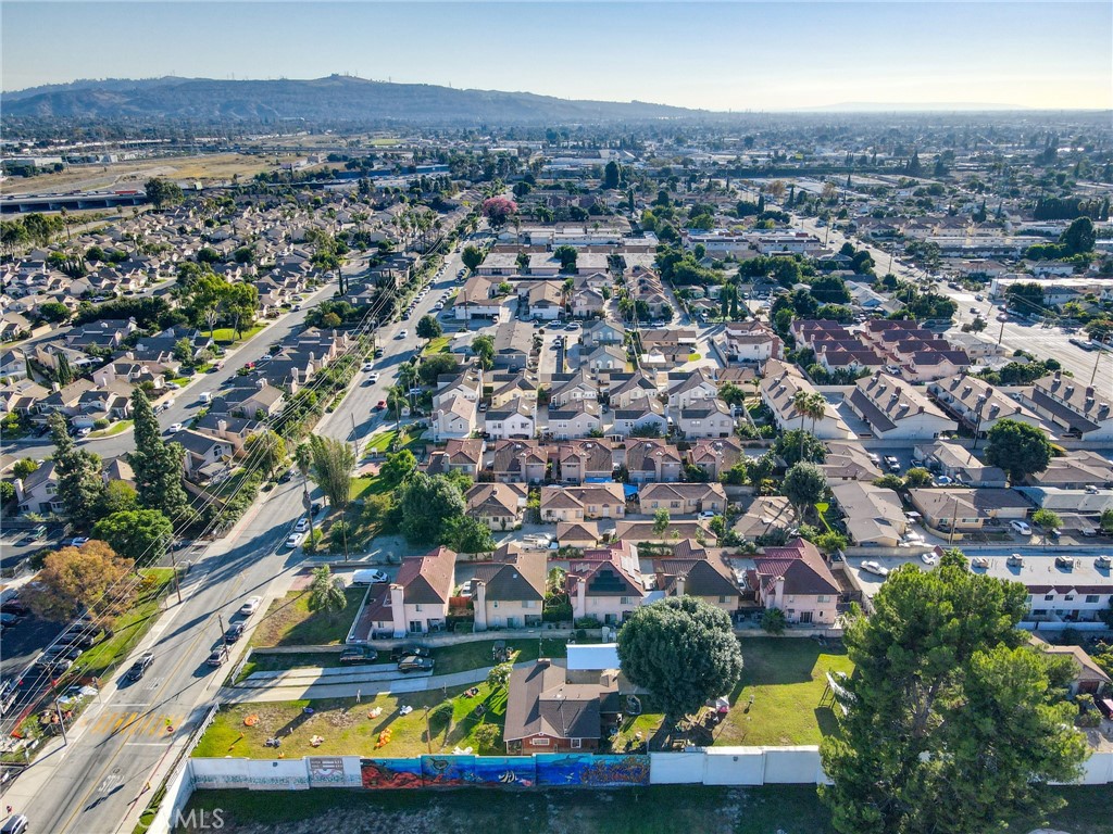 3903 Gilman Road El Monte, CA 91732 - Photo 8 of 10 an aerial view of residential houses with outdoor space and swimming pool