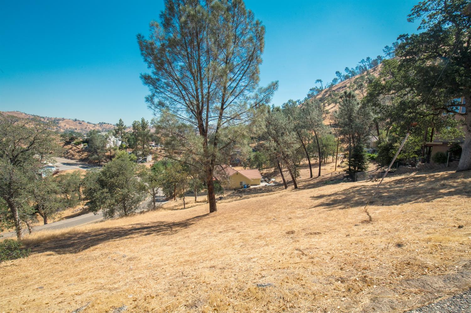 28486 Perkins Road Friant, CA 93626 - Photo 2 of 6 a view of a yard covered in snow