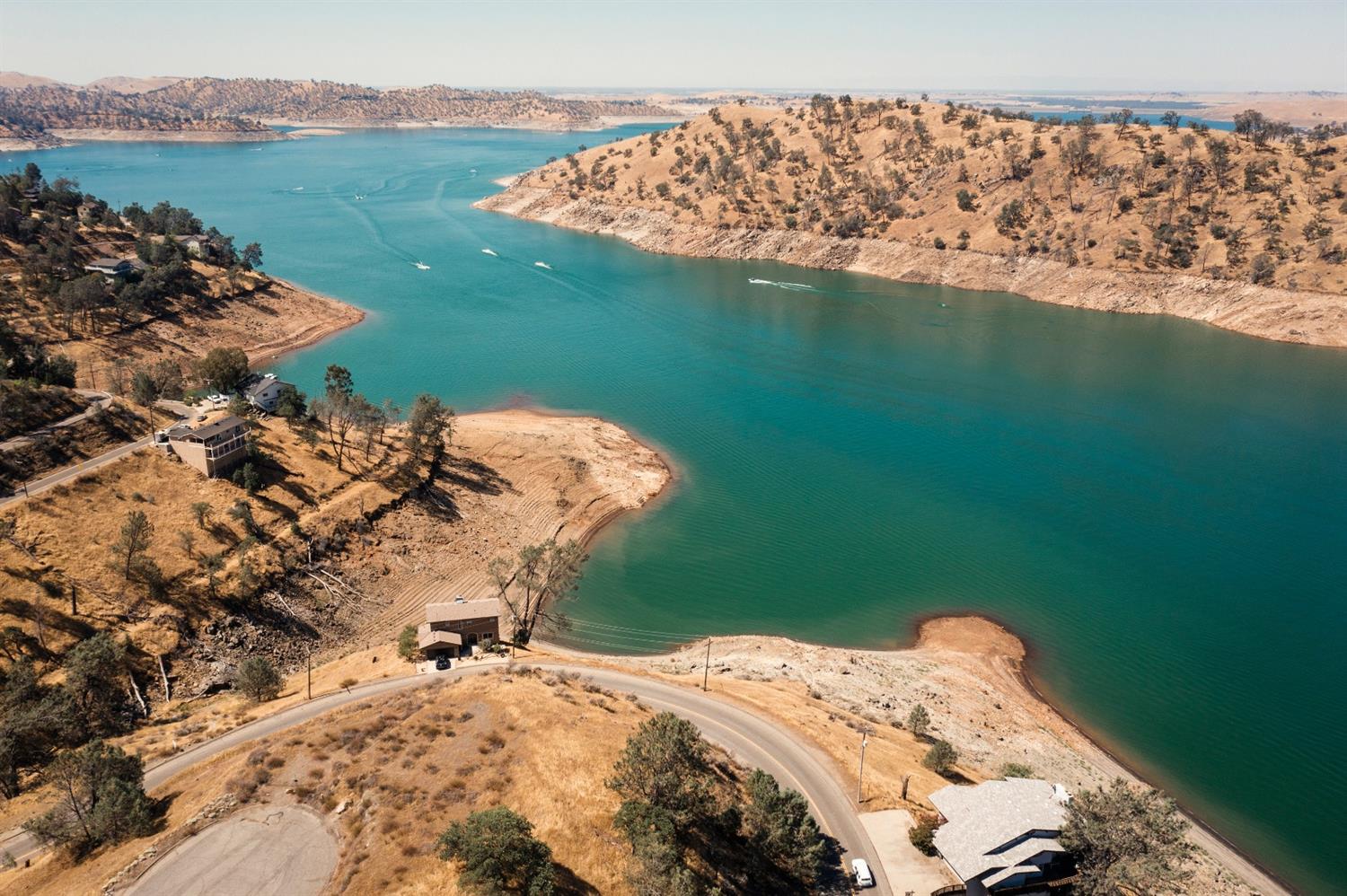 28486 Perkins Road Friant, CA 93626 - Photo 4 of 6 a view of a lake with a yard
