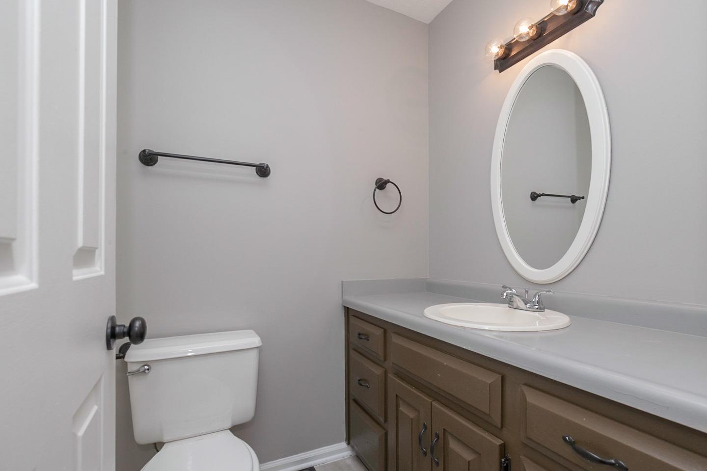 794 Spring Circle Springfield, TN 37172 - Photo 13 of 16 a bathroom with a toilet a sink and mirror