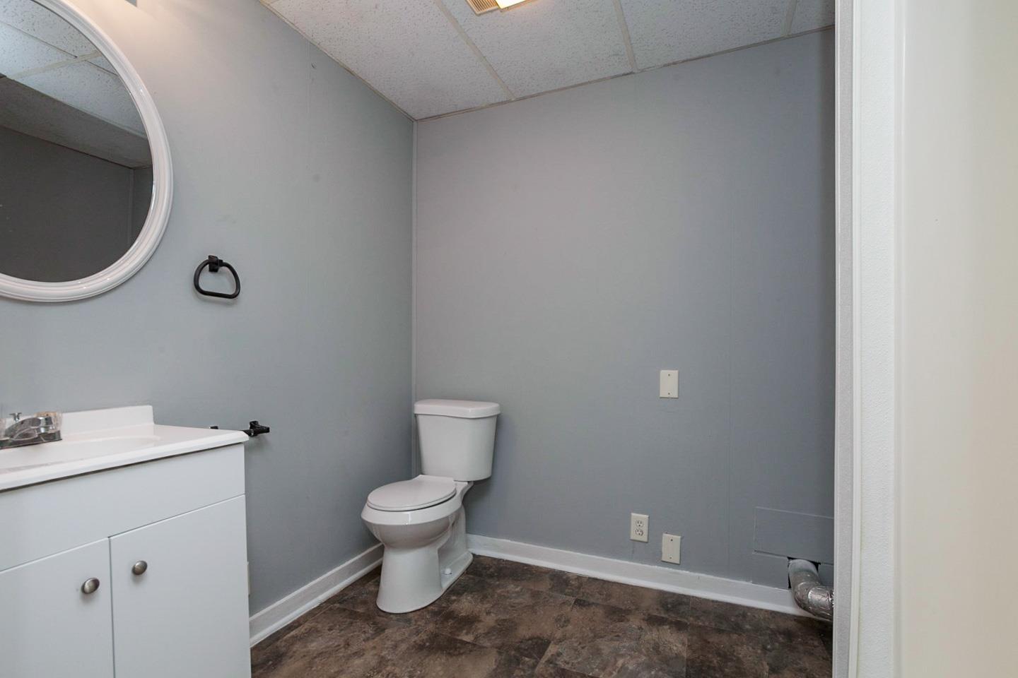 794 Spring Circle Springfield, TN 37172 - Photo 16 of 16 a white toilet sitting next to a bathroom sink