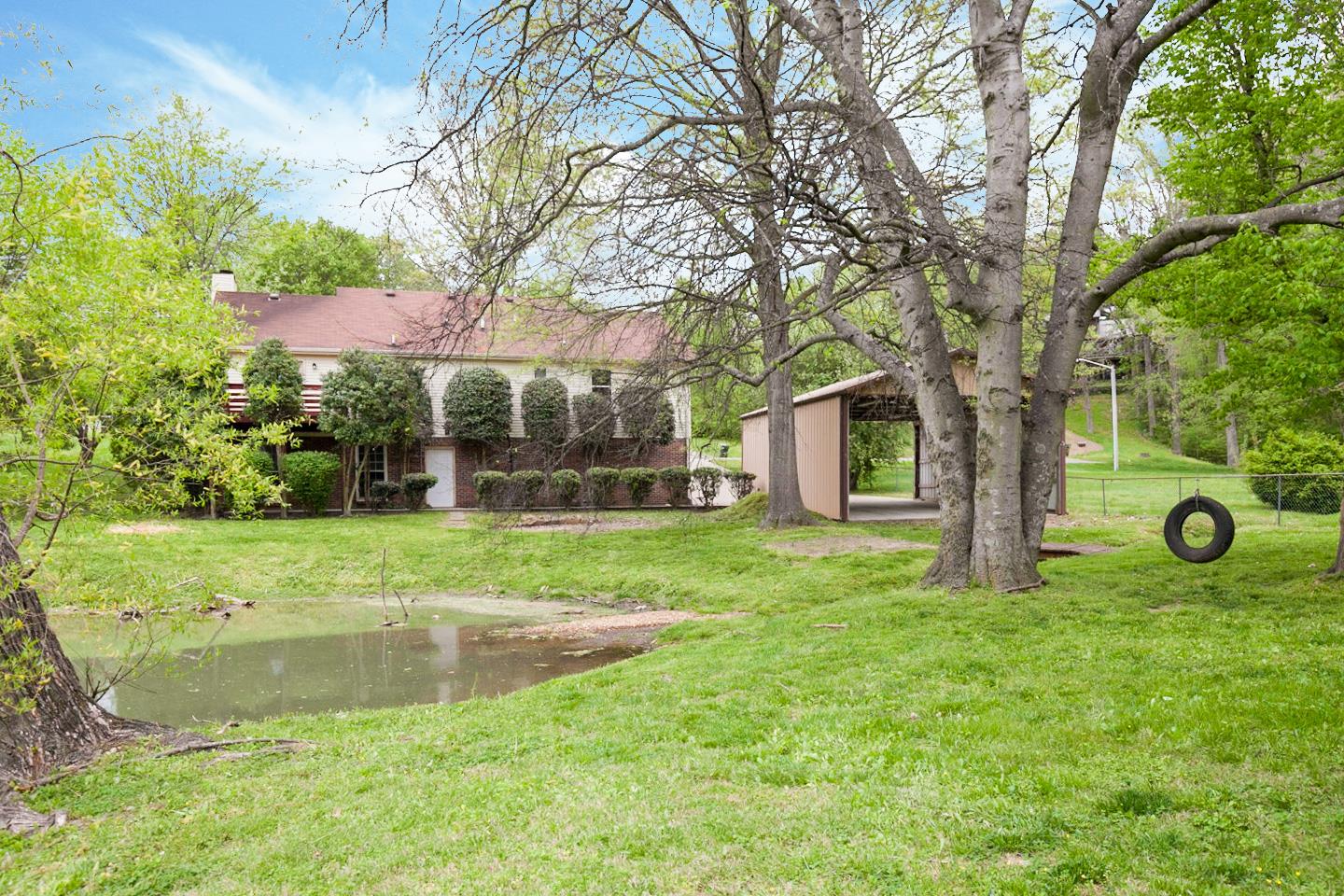794 Spring Circle Springfield, TN 37172 - Photo 5 of 16 a view of a backyard with large trees