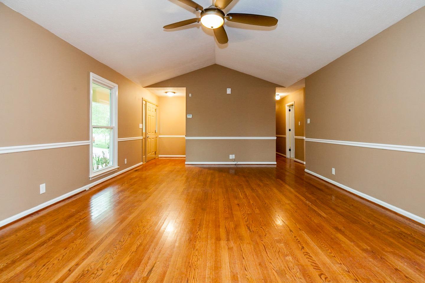 794 Spring Circle Springfield, TN 37172 - Photo 8 of 16 a view of an empty room with wooden floor and a window