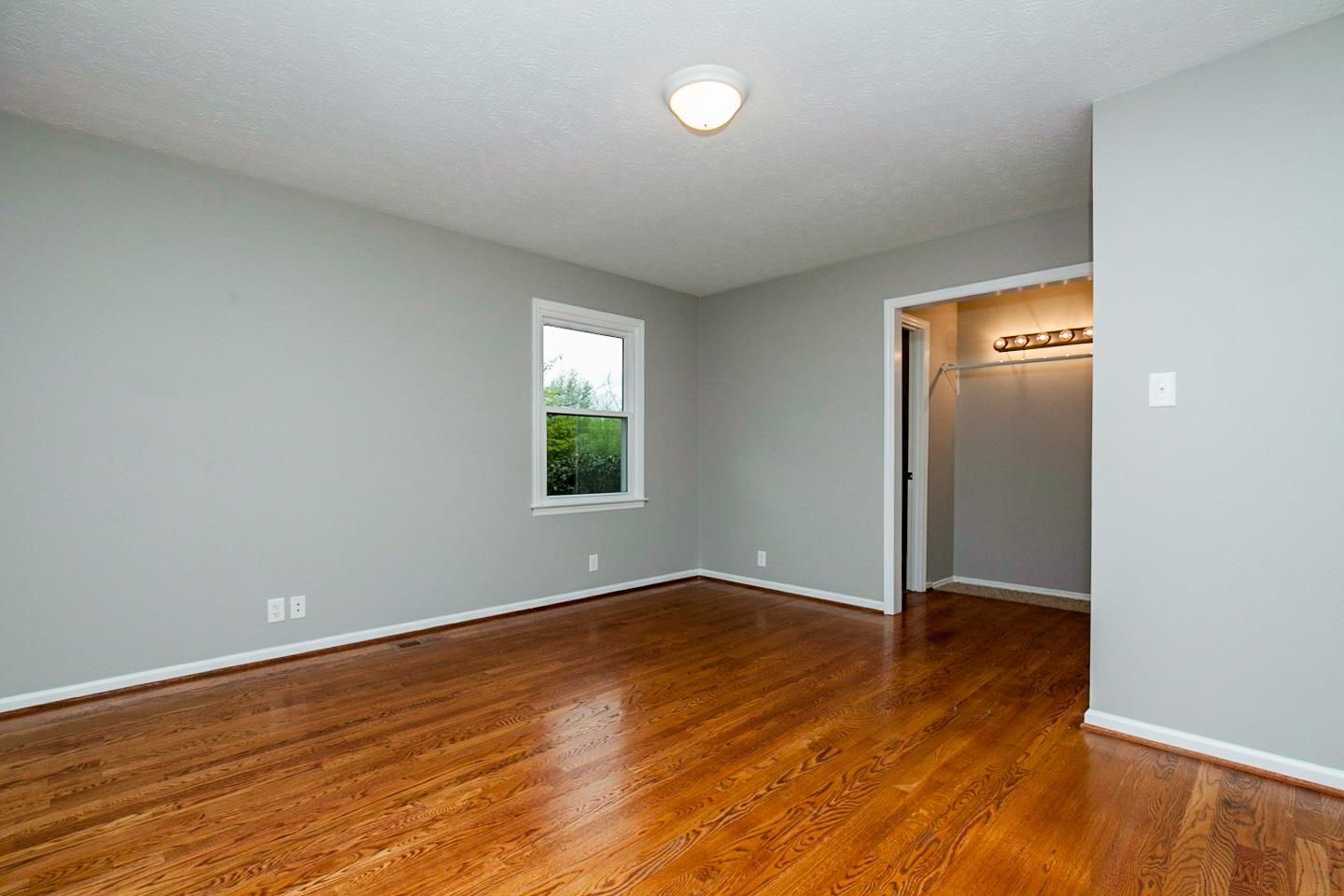 794 Spring Circle Springfield, TN 37172 - Photo 9 of 16 an empty room with wooden floor and windows
