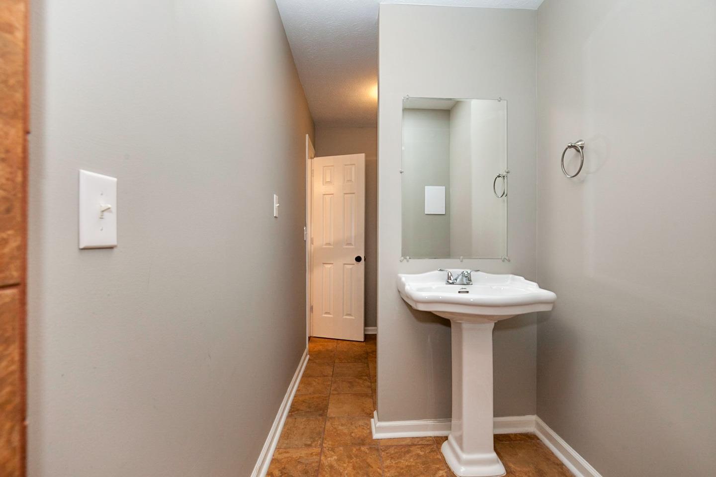 794 Spring Circle Springfield, TN 37172 - Photo 10 of 16 a bathroom with a sink and mirror