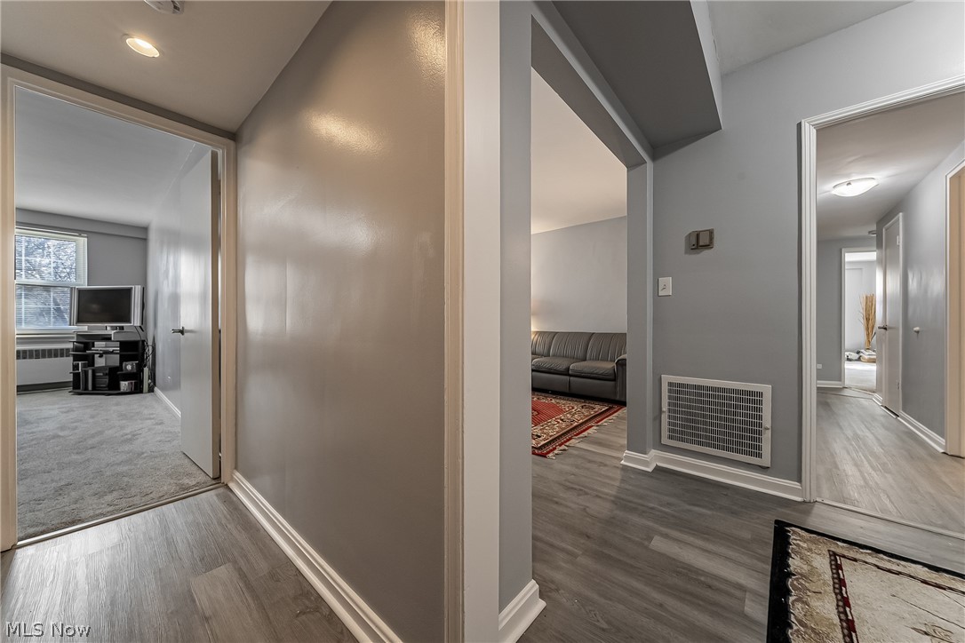 13800 Fairhill Road, Unit 306 Cleveland, OH 44120 - Photo 26 of 48 Hallway with dark wood finished floors, radiator heating unit, and recessed lighting