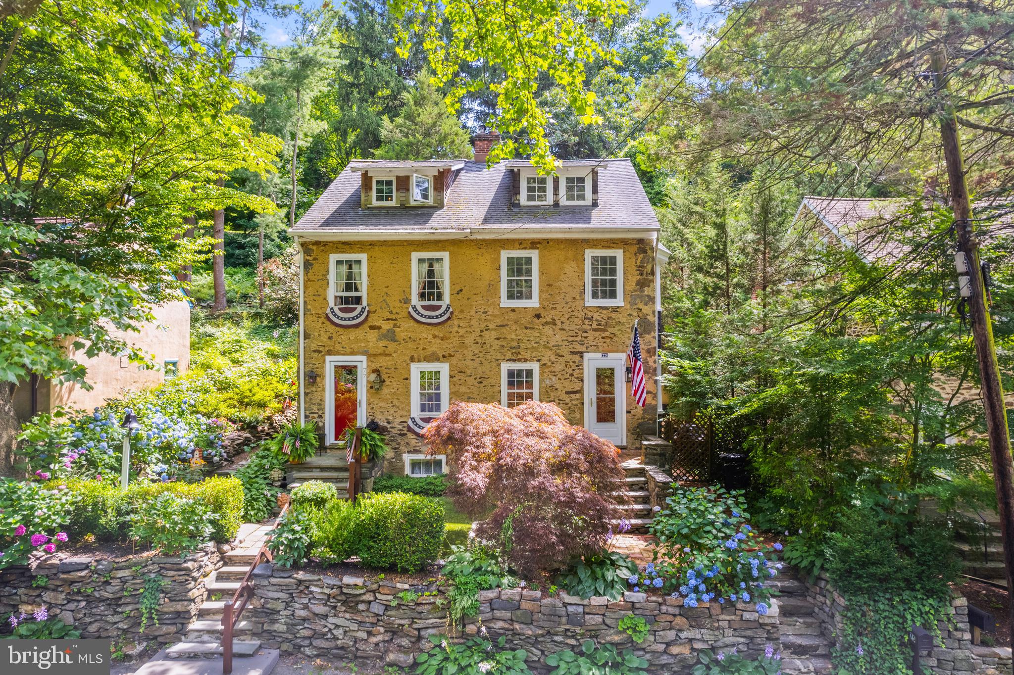 a view of a brick house with large windows