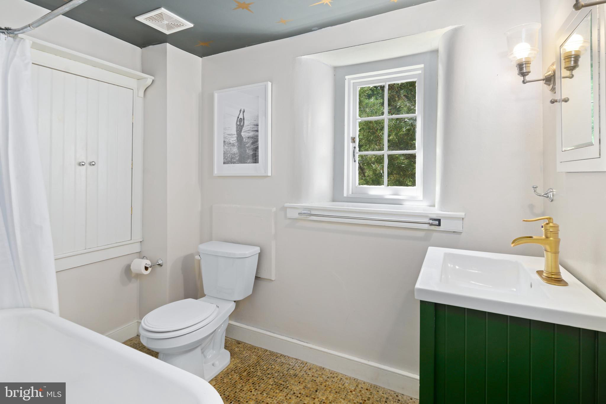 75 West Rose Valley Road Rose Valley, PA 19086 - Photo 17 of 31 a bathroom with a sink and a toilet