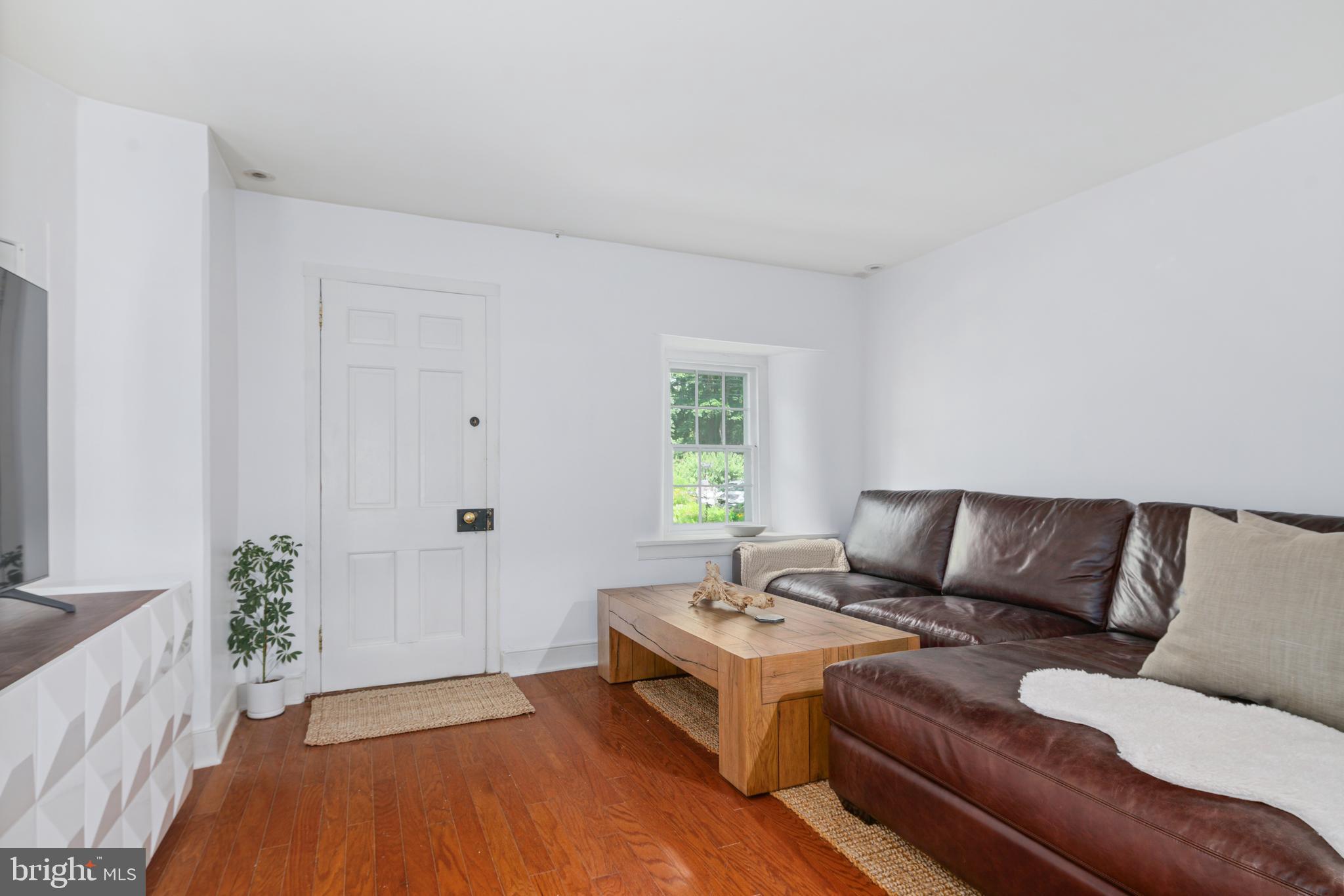 75 West Rose Valley Road Rose Valley, PA 19086 - Photo 2 of 31 a living room with furniture and a potted plant