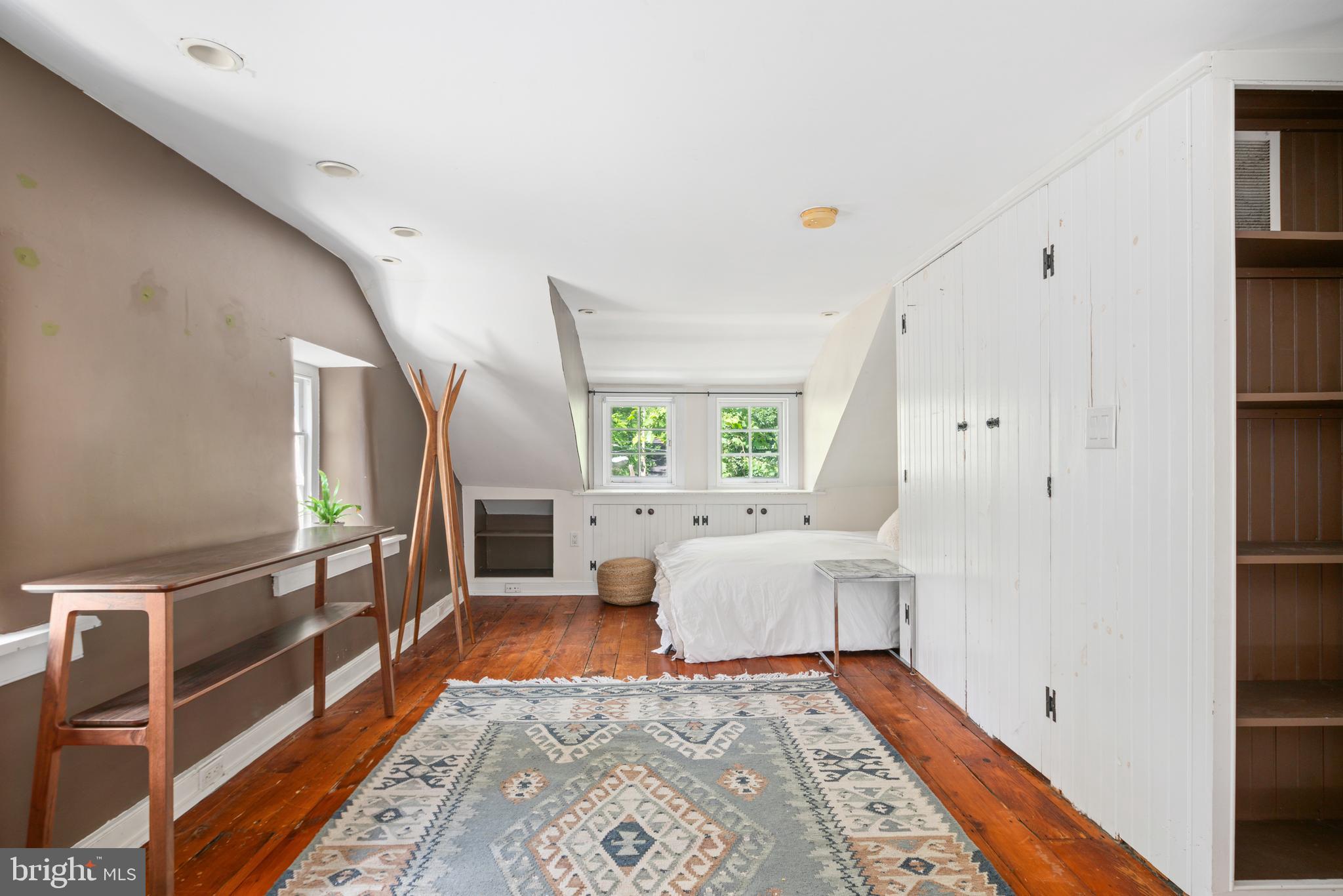 75 West Rose Valley Road Rose Valley, PA 19086 - Photo 23 of 31 a large white bed in a white room with a rug
