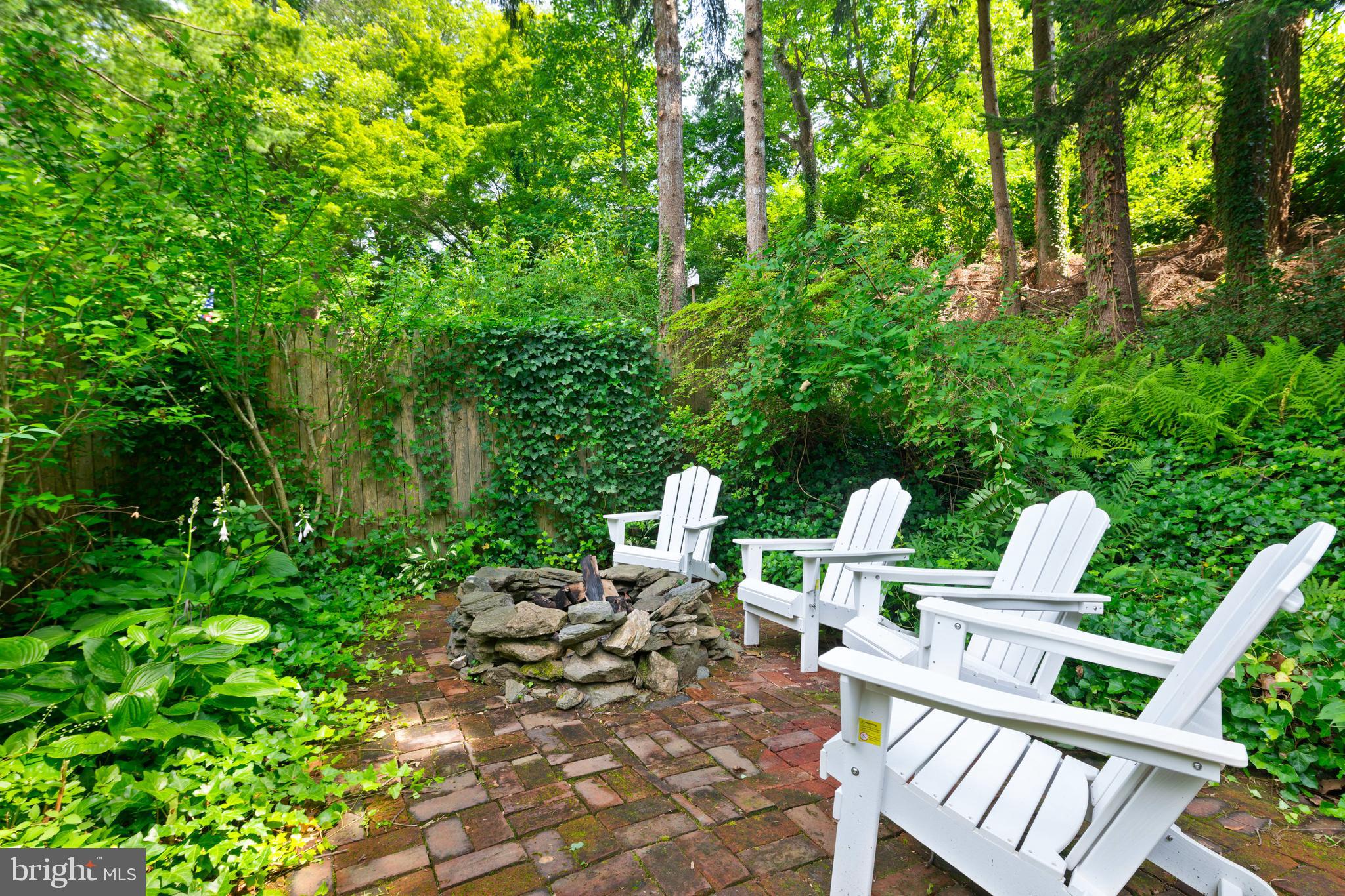 75 West Rose Valley Road Rose Valley, PA 19086 - Photo 29 of 31 a view of an chairs and tables in the backyard