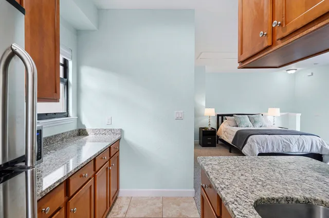 a bedroom with a bed and a dresser