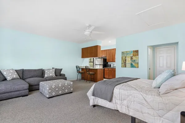 a bedroom with furniture and a couch