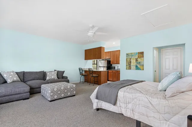 a bedroom with furniture and a couch