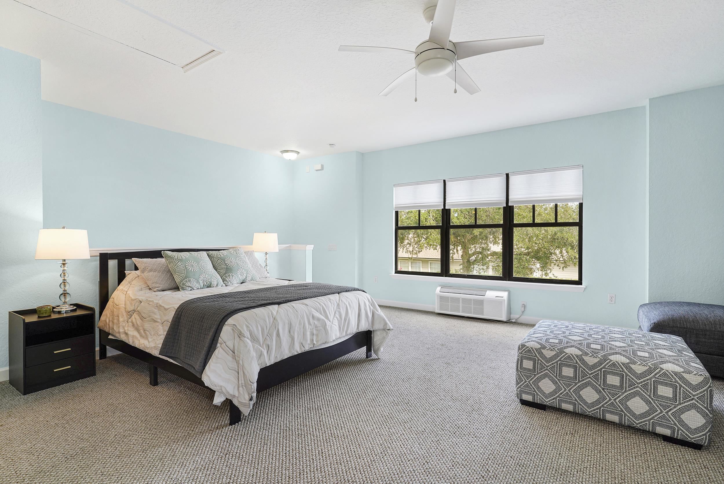 Undisclosed Address St. Augustine, FL 32095 - Photo 9 of 23 a spacious bedroom with a bed and a window