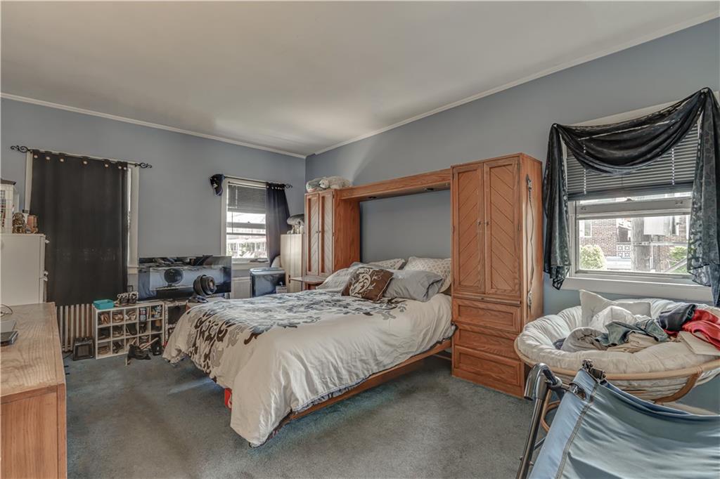 623 Ave Y Brooklyn, NY 11235 - Photo 11 of 24 a bedroom with bed and a window