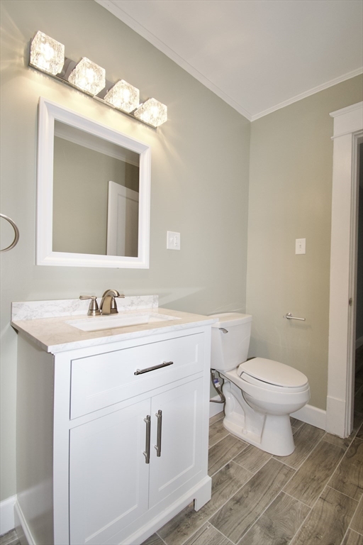 158 Gilbert Avenue Springfield, MA 01119 - Photo 14 of 30 a bathroom with a toilet a sink and a mirror