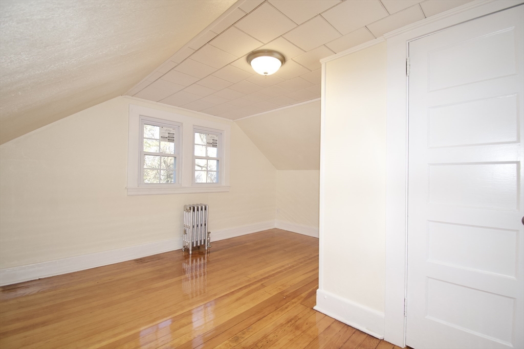 158 Gilbert Avenue Springfield, MA 01119 - Photo 21 of 30 an empty room with wooden floor and windows