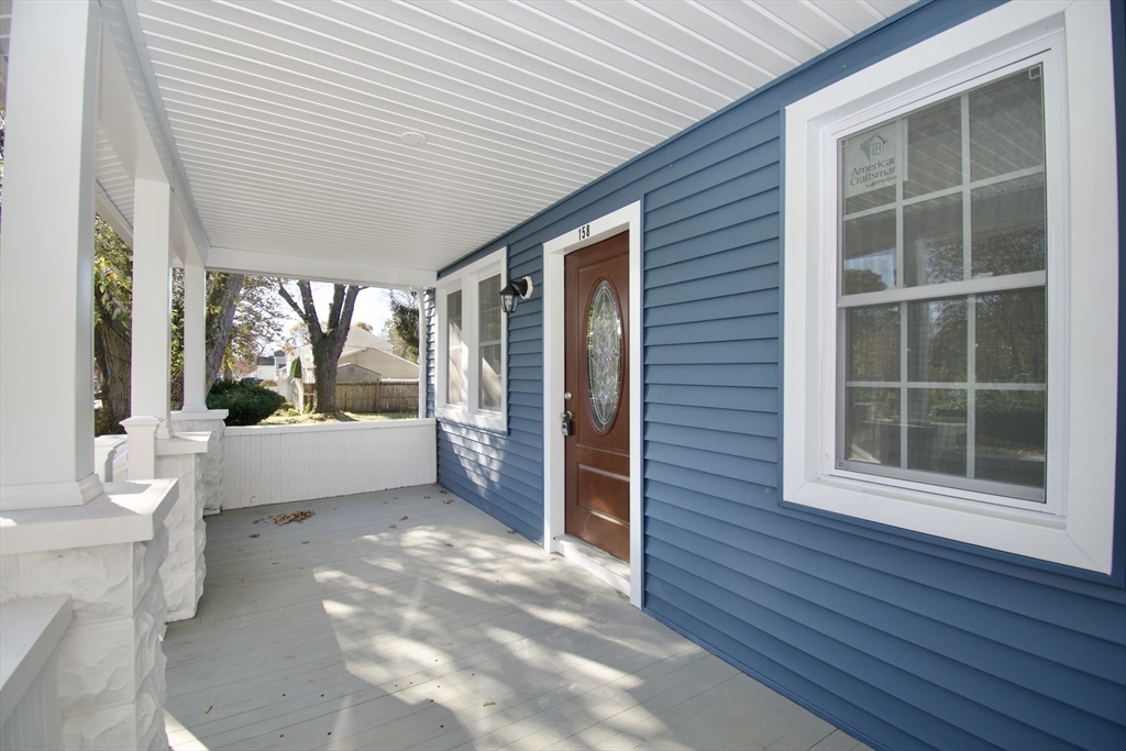 158 Gilbert Avenue Springfield, MA 01119 - Photo 4 of 30 a view of a porch with furniture and wooden floor