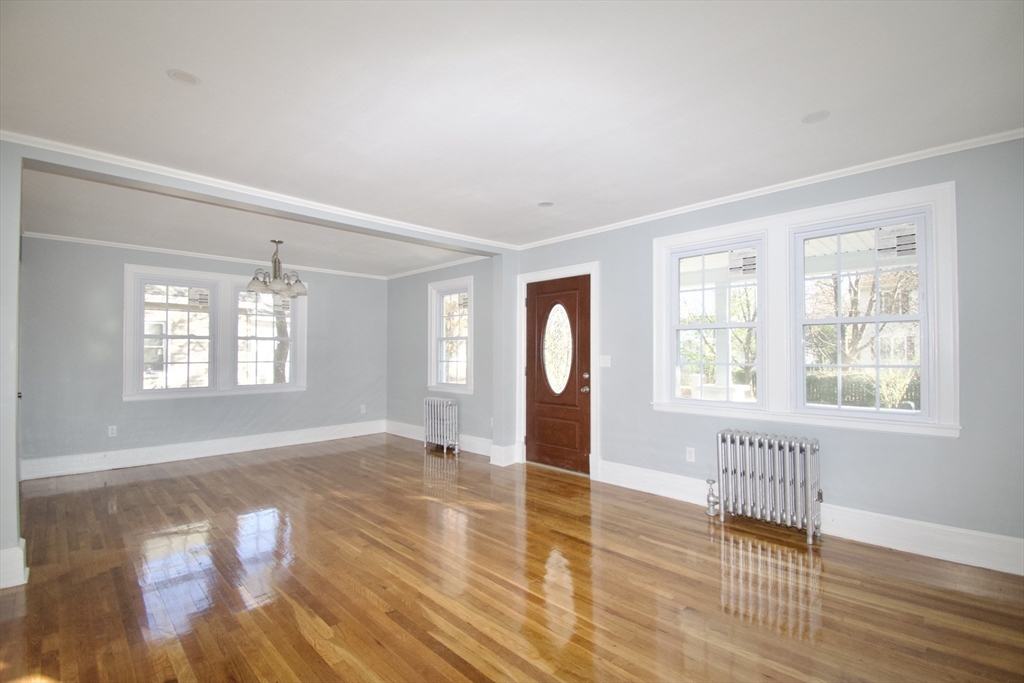 158 Gilbert Avenue Springfield, MA 01119 - Photo 7 of 30 an empty room with wooden floor and windows