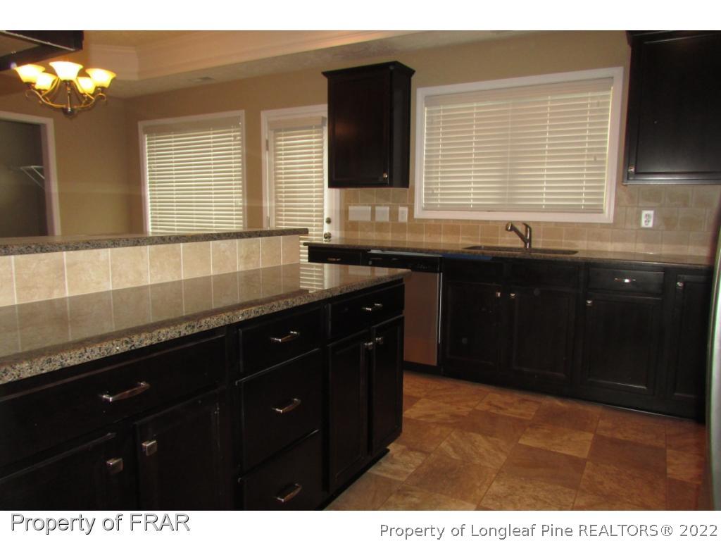 3341 Thrower Road Hope Mills, NC 28348 - Photo 11 of 32 a kitchen with a sink and a window