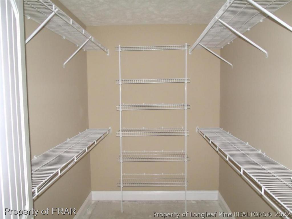 3341 Thrower Road Hope Mills, NC 28348 - Photo 16 of 32 a view of an empty walk in closet