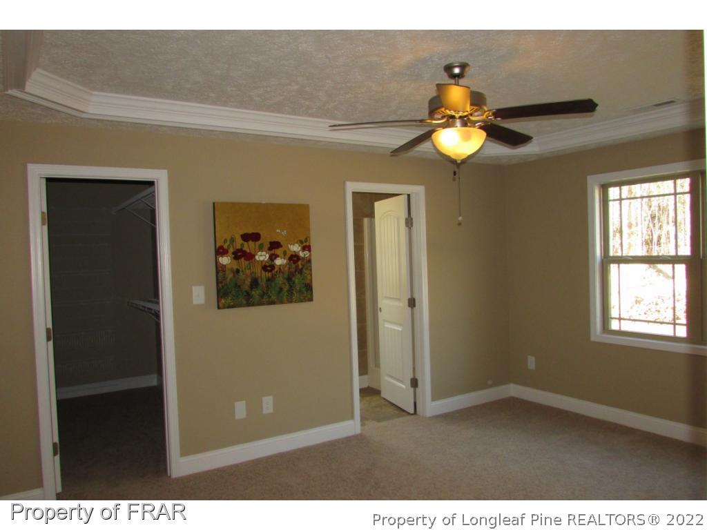 3341 Thrower Road Hope Mills, NC 28348 - Photo 29 of 32 a view of a chandelier fan and a window