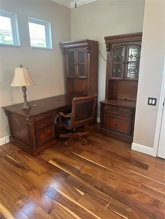 a room with furniture and wooden floor