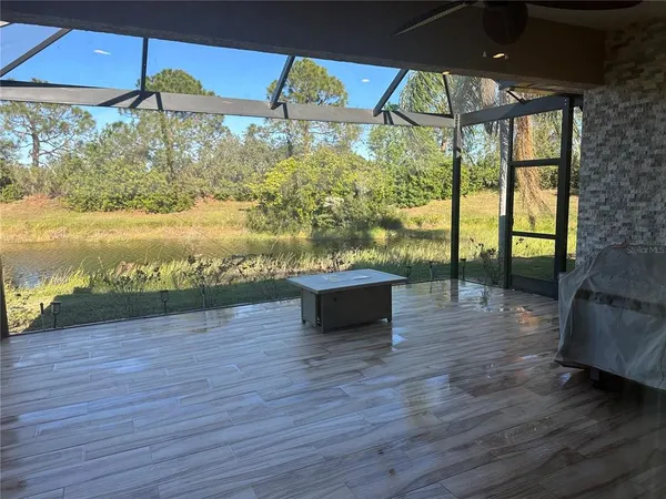 a view of a floor to ceiling window and wooden floor