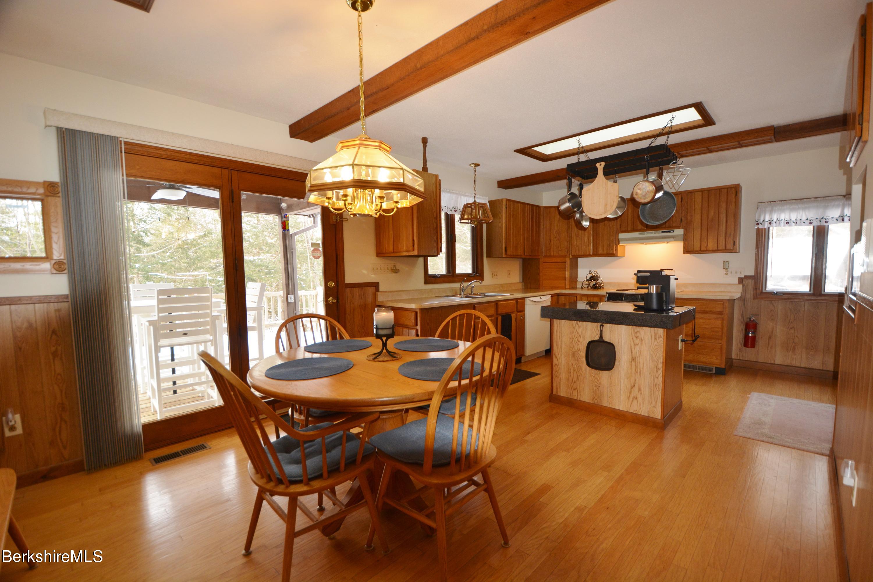 106 Pine Road Otis, MA 01029 - Photo 2 of 19 a dining room with furniture and large windows