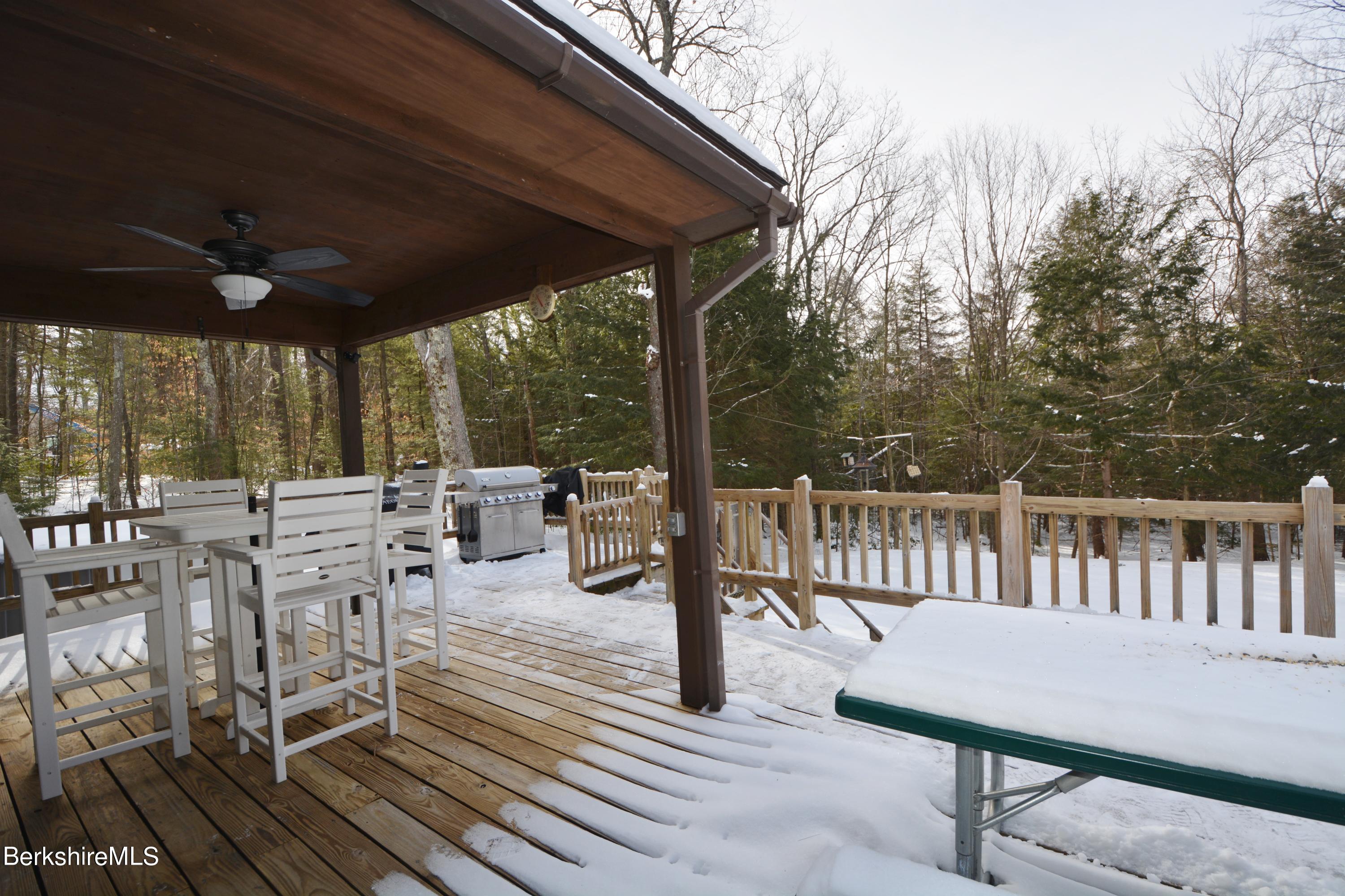 106 Pine Road Otis, MA 01029 - Photo 11 of 19 a view of a patio with a table chairs and backyard