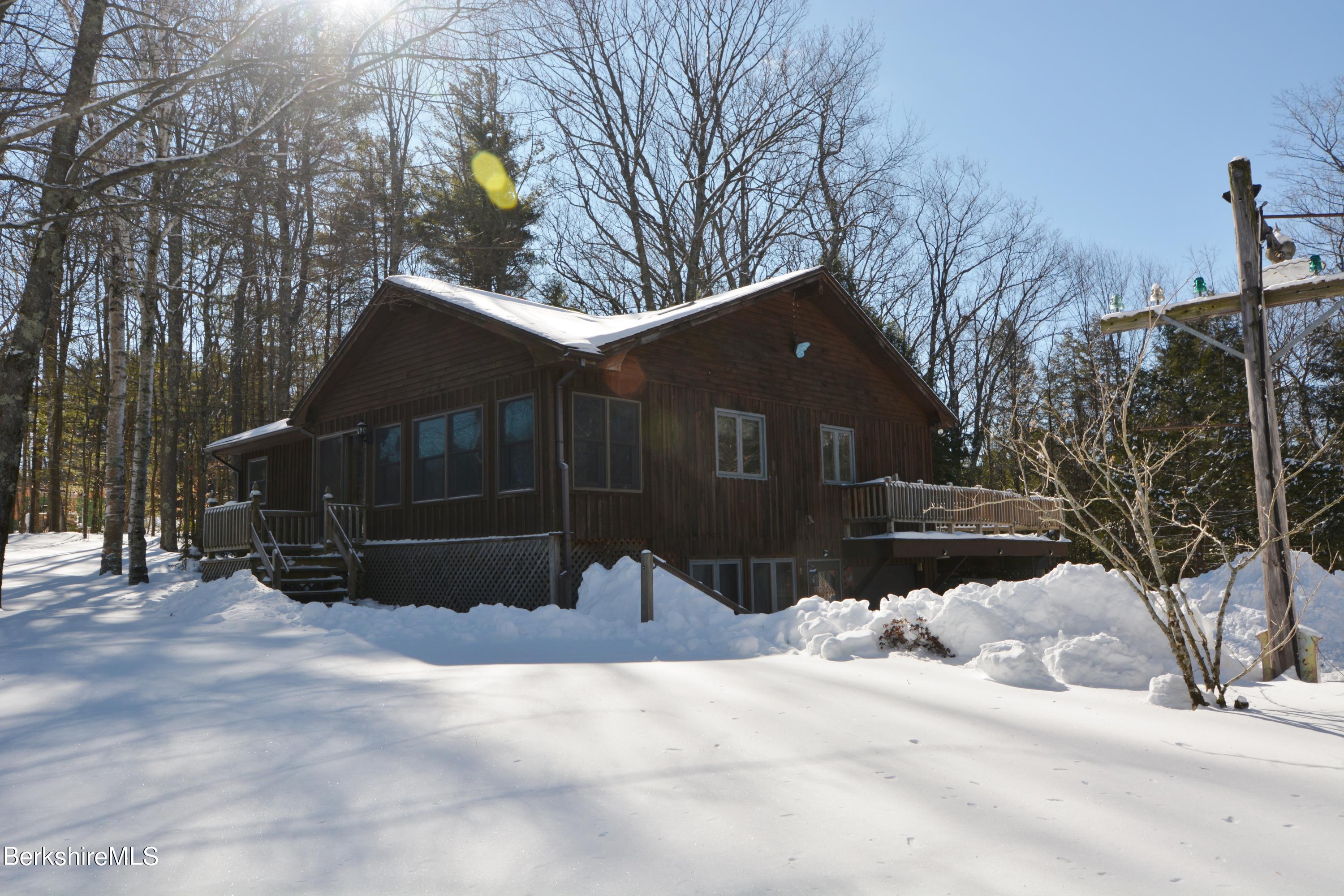 106 Pine Road Otis, MA 01029 - Photo 15 of 19 a house covered with snow in front of house