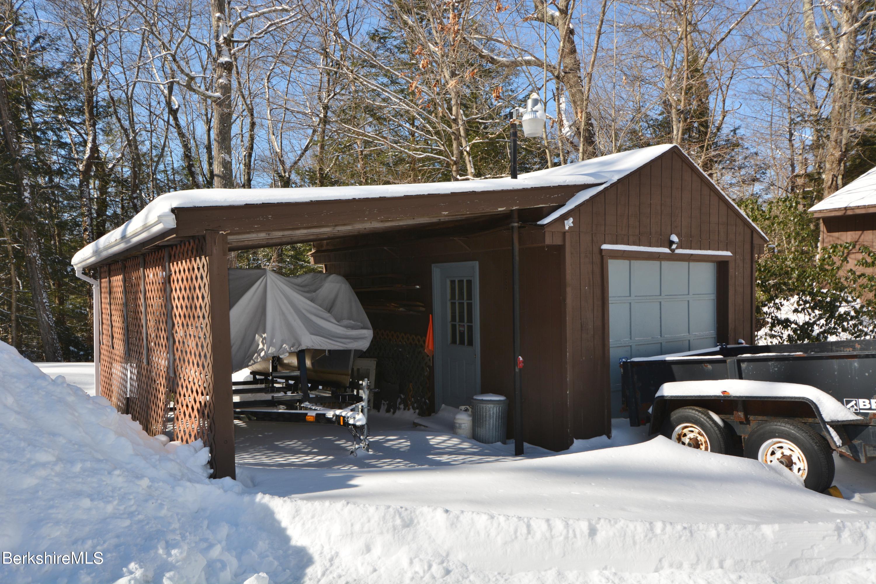 106 Pine Road Otis, MA 01029 - Photo 18 of 19 a front view of a house with a yard