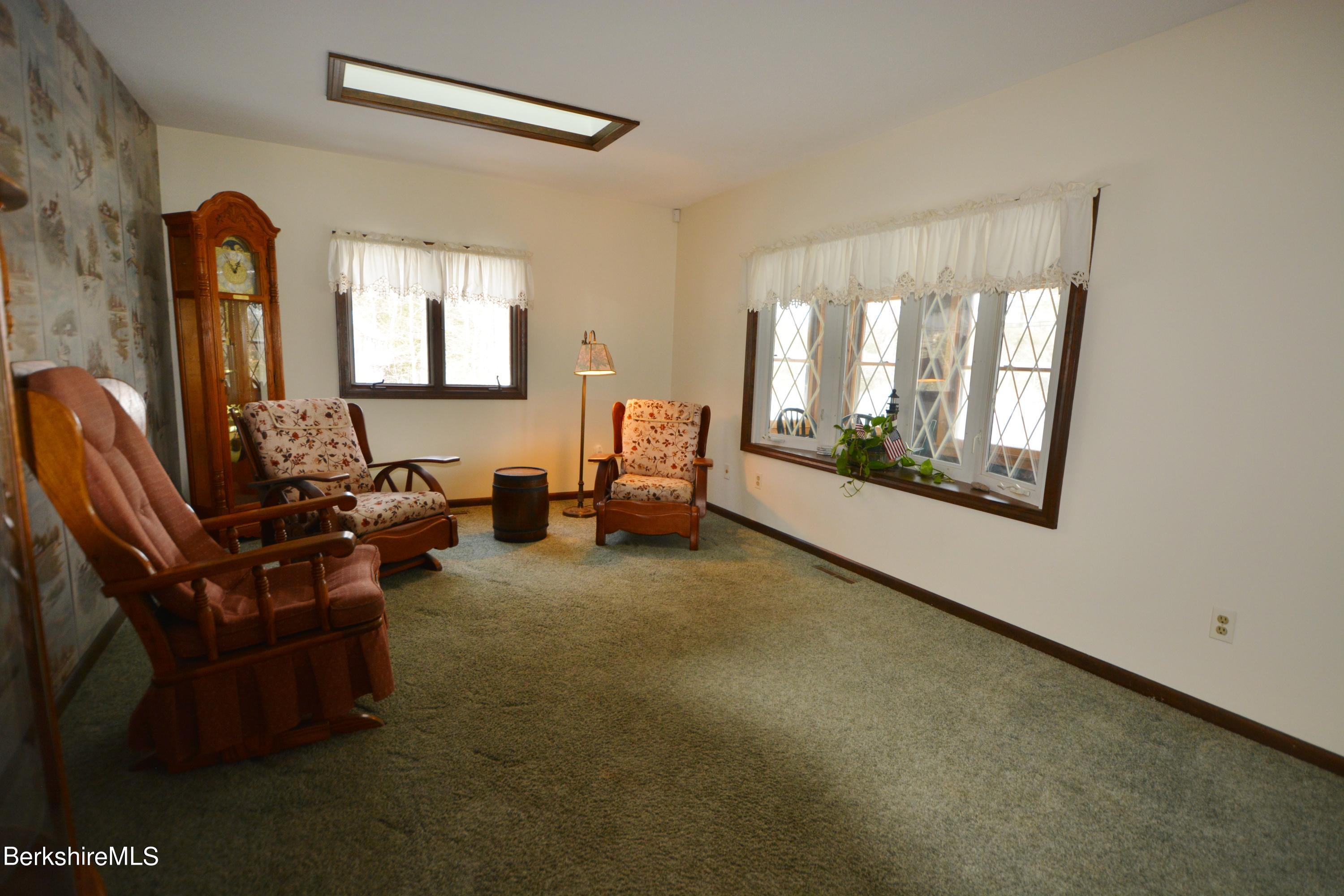 106 Pine Road Otis, MA 01029 - Photo 5 of 19 a living room with furniture and a window