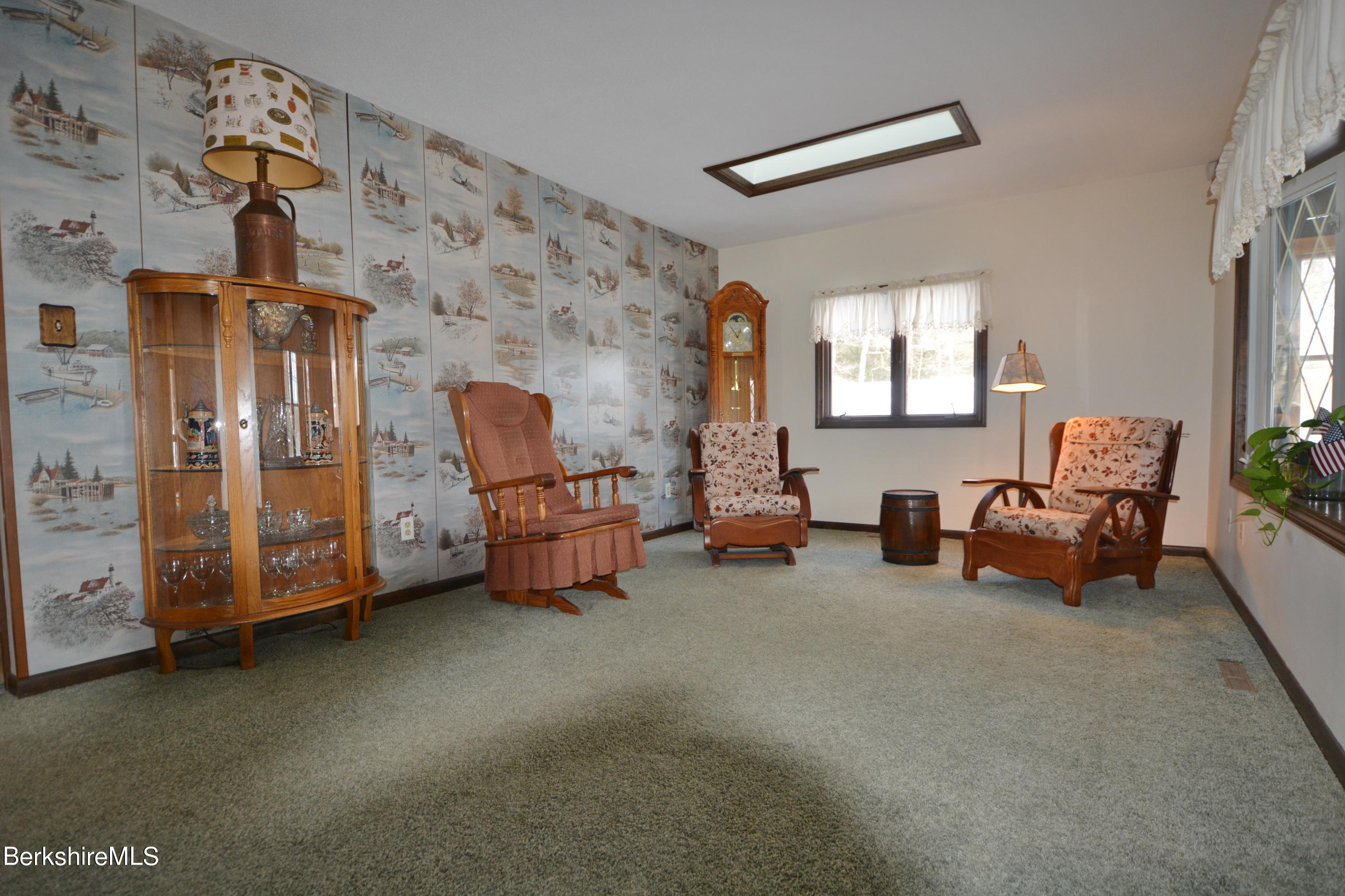 106 Pine Road Otis, MA 01029 - Photo 6 of 19 a bed room with furniture and a window