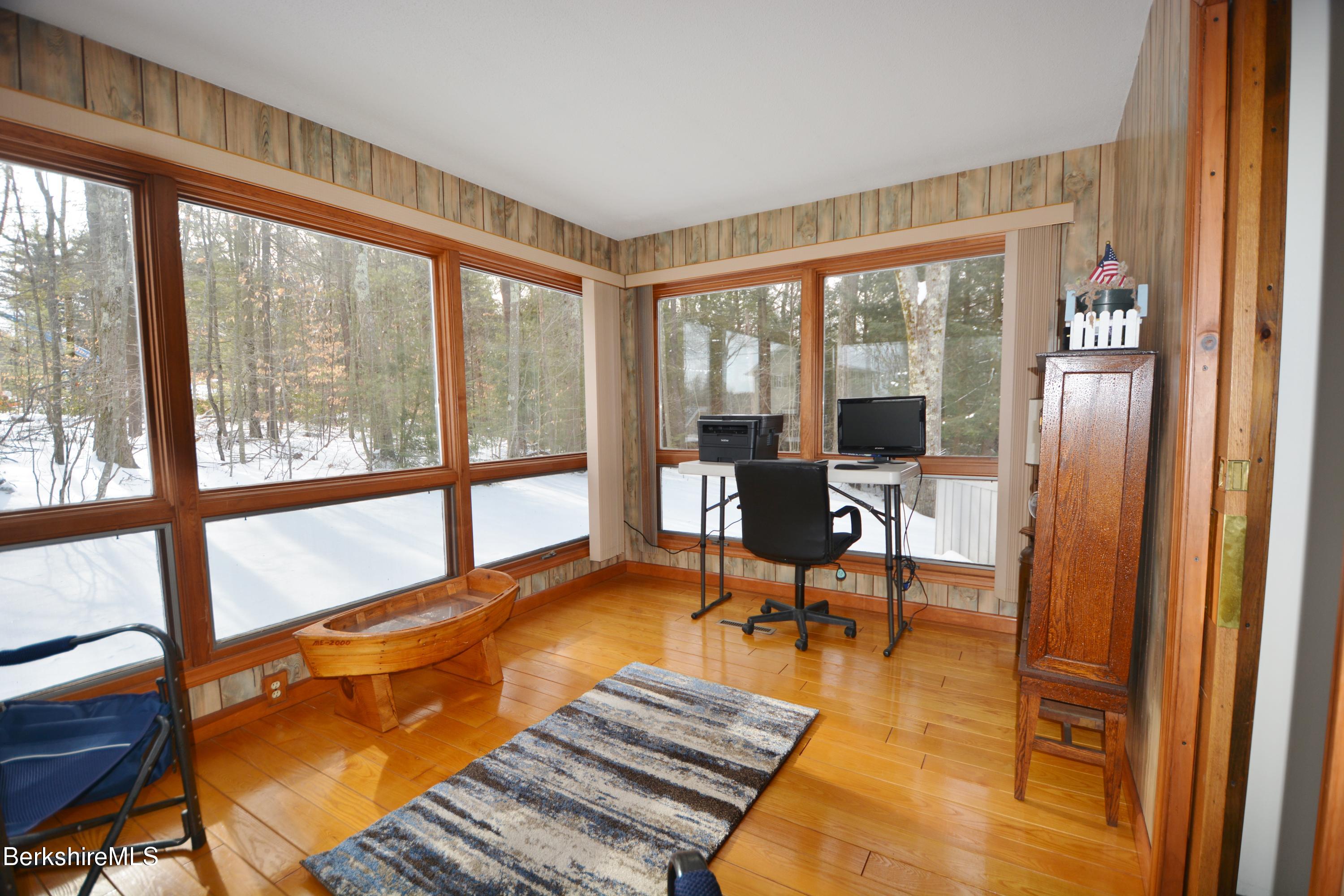 106 Pine Road Otis, MA 01029 - Photo 7 of 19 a living room filled with furniture and a large window