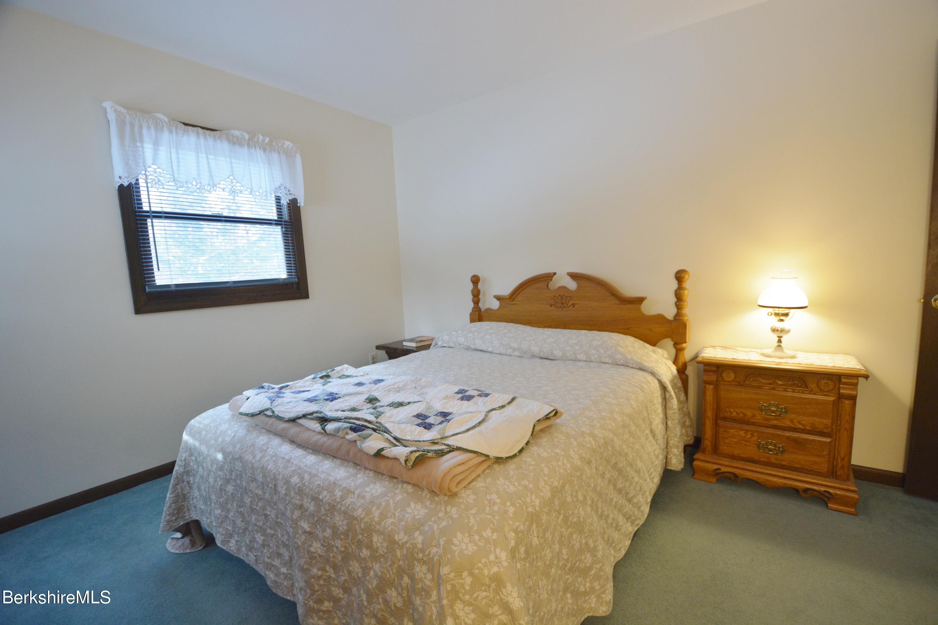 106 Pine Road Otis, MA 01029 - Photo 8 of 19 a bedroom with a bed and window