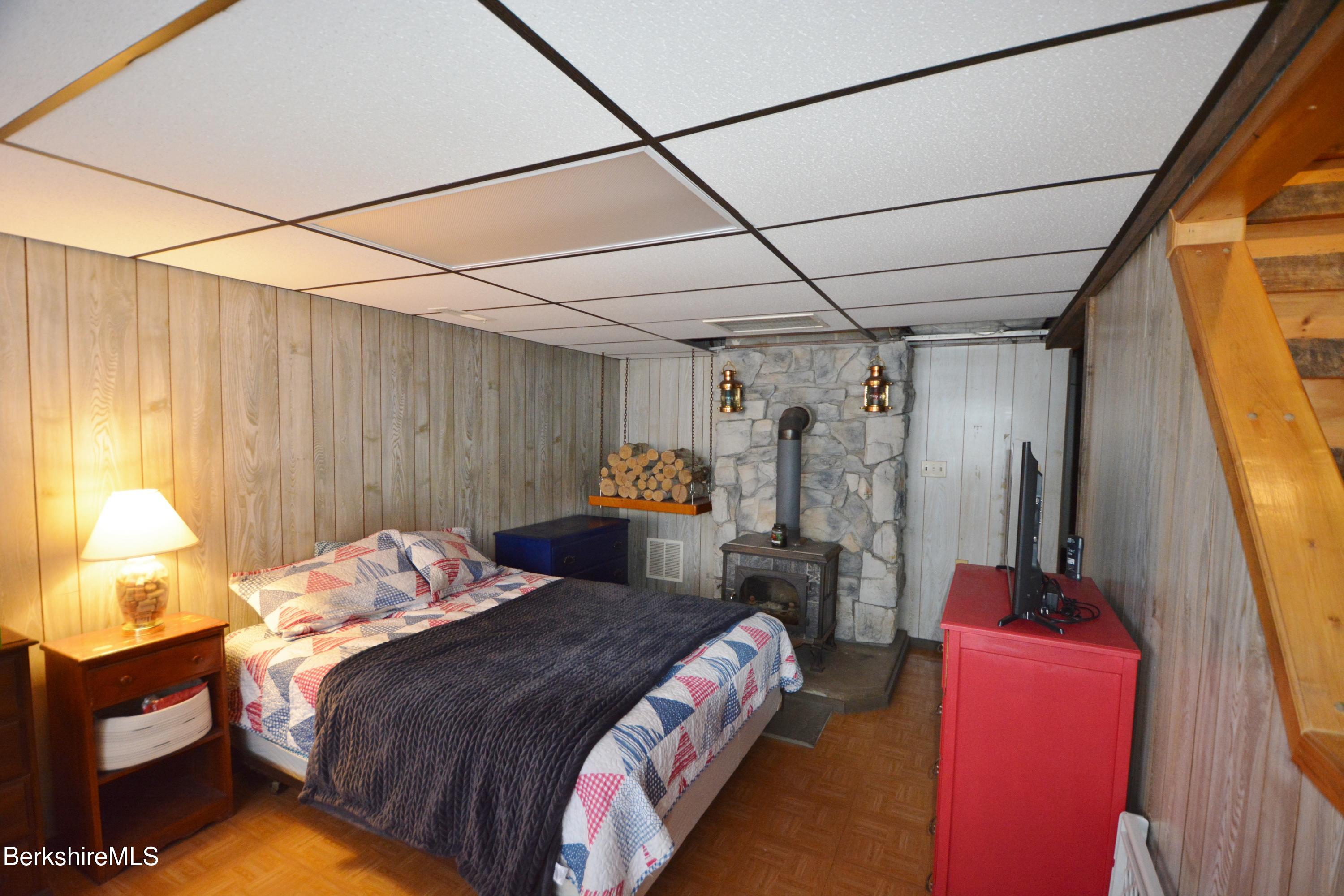 106 Pine Road Otis, MA 01029 - Photo 10 of 19 a bedroom with a bed and a window