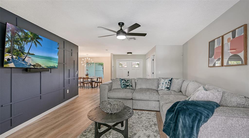 3924 Helene Street Sarasota, FL 34233 - Photo 12 of 53 a living room with furniture and a flat screen tv