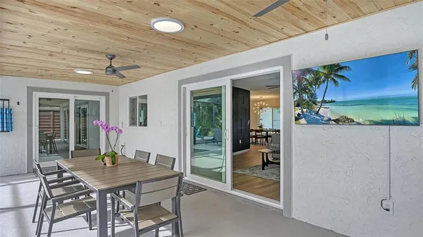 a view of a patio with table and chairs