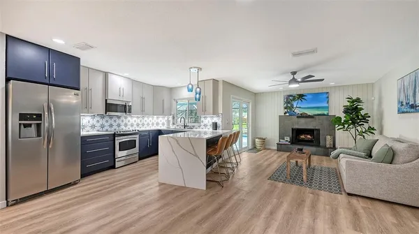 a living room with furniture and a fireplace
