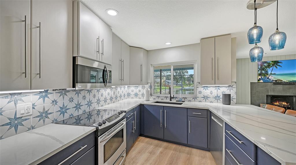 3924 Helene Street Sarasota, FL 34233 - Photo 21 of 53 a kitchen with a sink stove and microwave