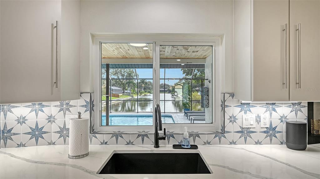 3924 Helene Street Sarasota, FL 34233 - Photo 22 of 53 a view of a sink and a window with couch