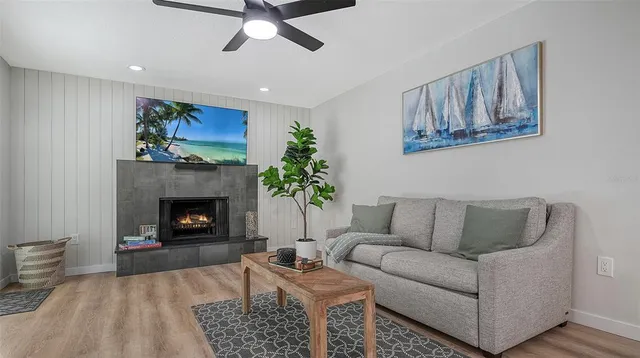 a living room with furniture and a fireplace