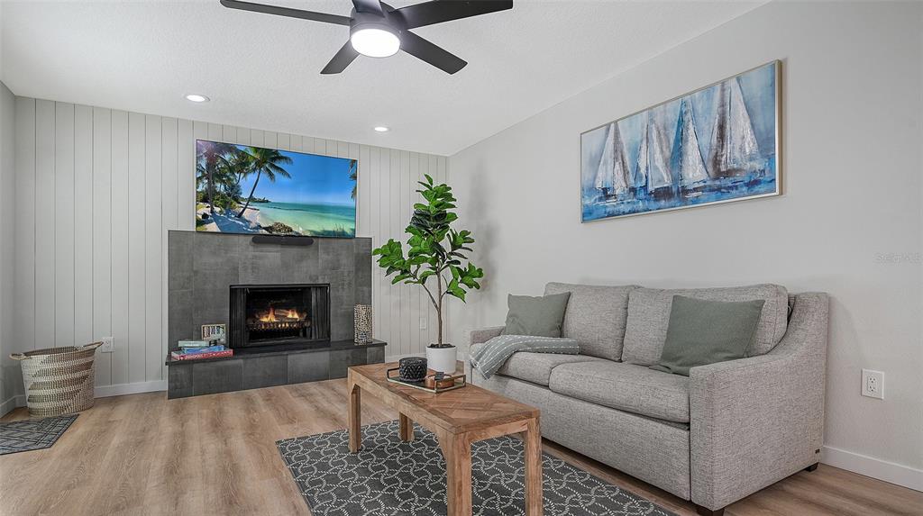 3924 Helene Street Sarasota, FL 34233 - Photo 30 of 53 a living room with furniture and a fireplace