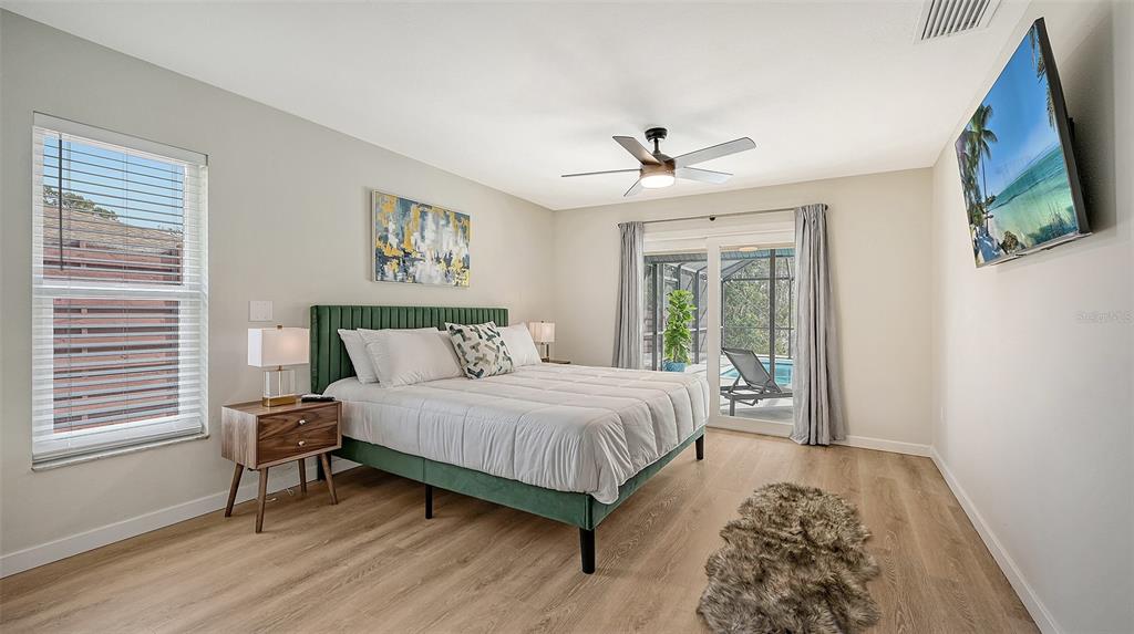 3924 Helene Street Sarasota, FL 34233 - Photo 33 of 53 a bedroom with a large bed and a window