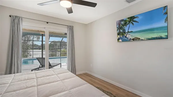 a room with a balcony and furniture