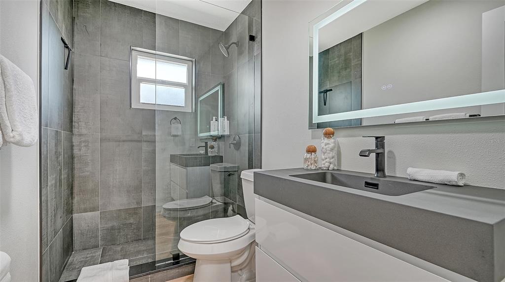 3924 Helene Street Sarasota, FL 34233 - Photo 40 of 53 a bathroom with a sink toilet and shower