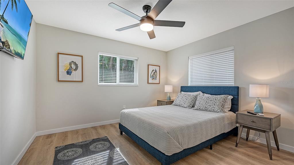 3924 Helene Street Sarasota, FL 34233 - Photo 41 of 53 a bedroom with a bed and a lamp